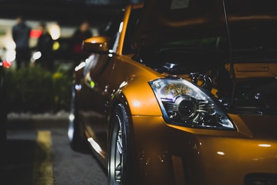 Yellow porsche 911 roads at night
